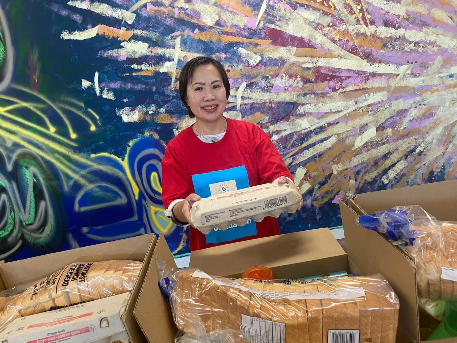 A volunteer with bread